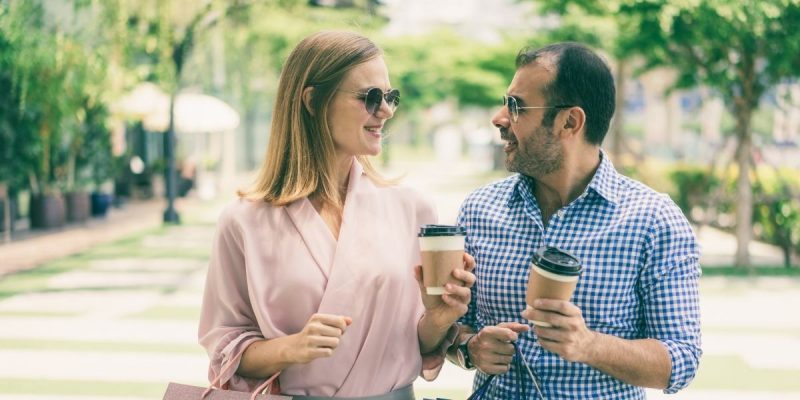 happy male female couple on the street