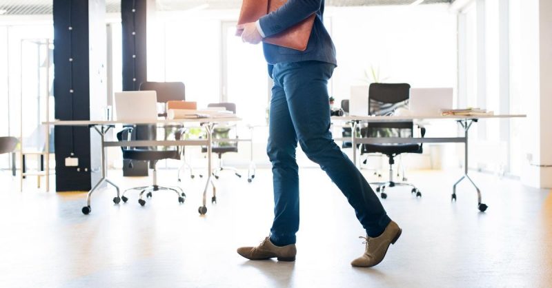 injured man walking in the office